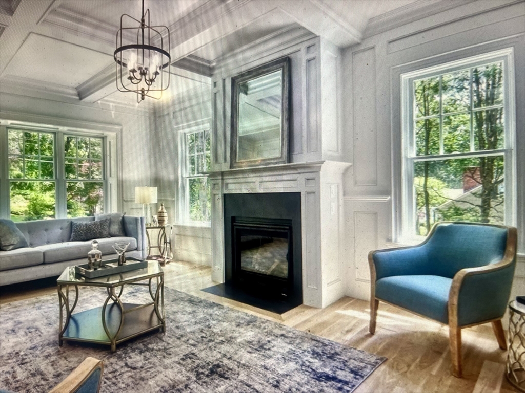 45 Widow Rites Lane Sudbury, MA 01776 - Photo 17 of 25 a living room with furniture a window and a fireplace