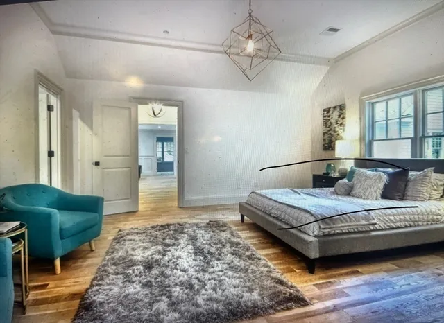 a bedroom with a bed and a couch