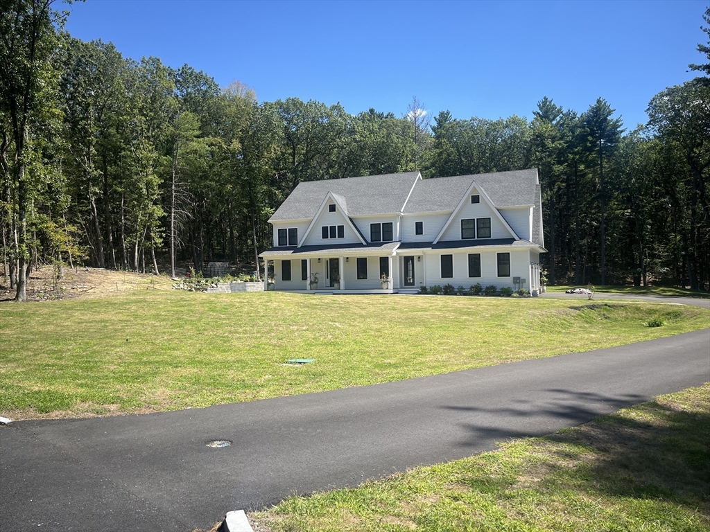 45 Widow Rites Lane Sudbury, MA 01776 - Photo 2 of 25 a front view of a house with a swimming pool