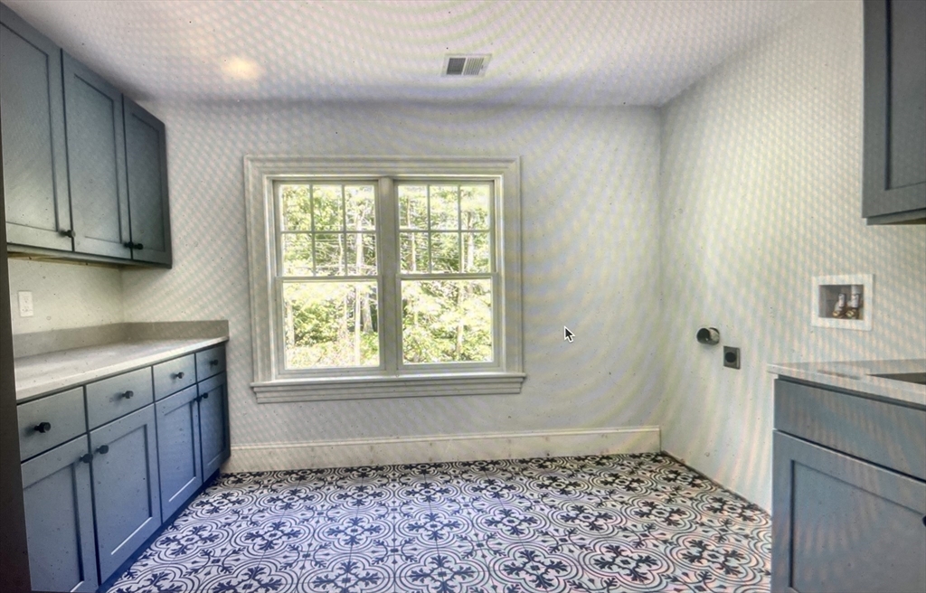 45 Widow Rites Lane Sudbury, MA 01776 - Photo 22 of 25 a bathroom with a sink a toilet a window and vanity