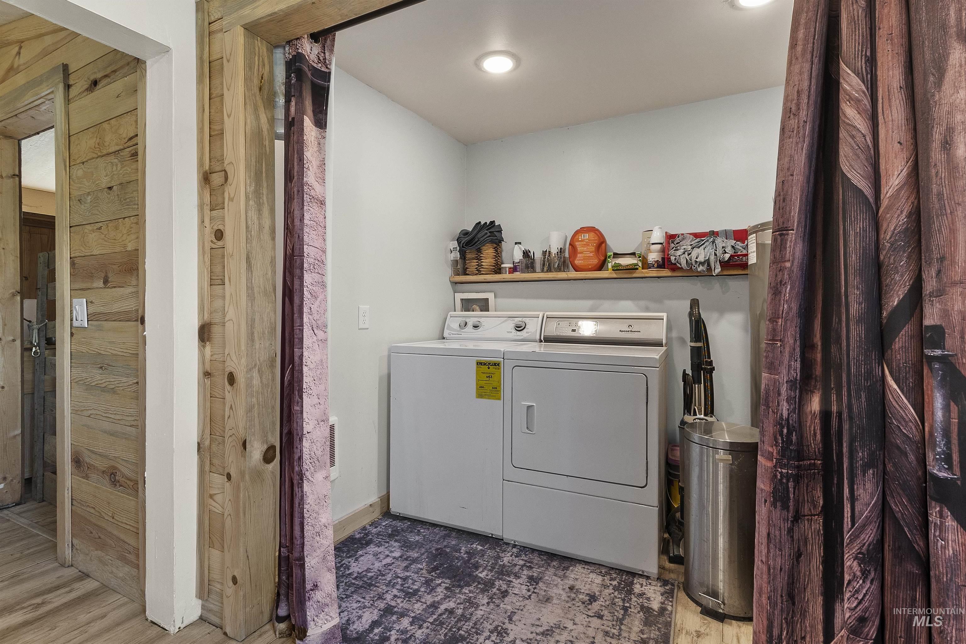1311 Gold Hill Road Princeton, ID 83857 - Photo 19 of 25 Laundry room with separate washer and dryer, wood finished floors, and a sauna