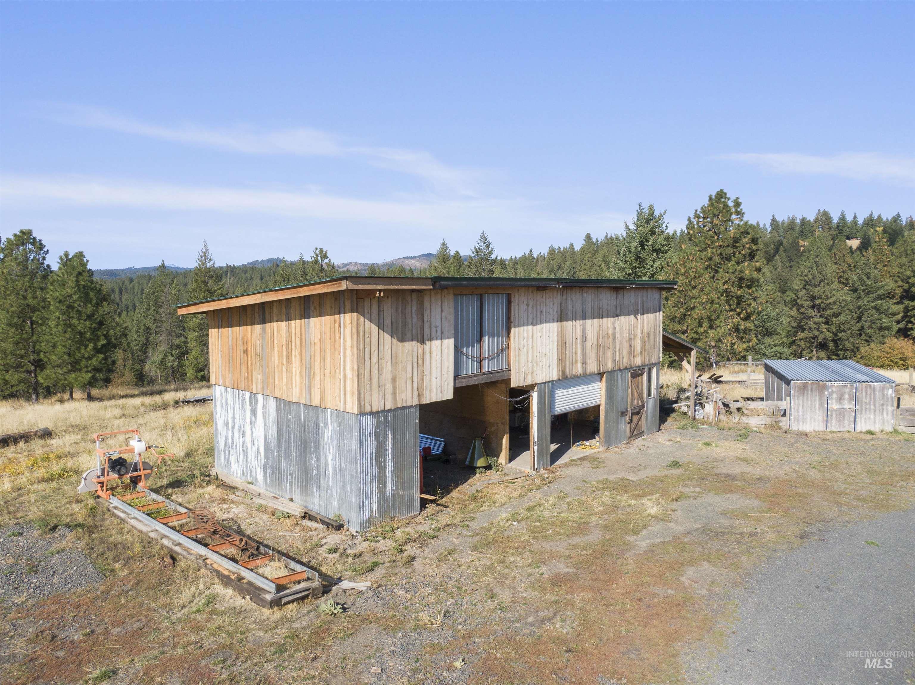 1311 Gold Hill Road Princeton, ID 83857 - Photo 24 of 25 View of outdoor structure featuring a view of trees
