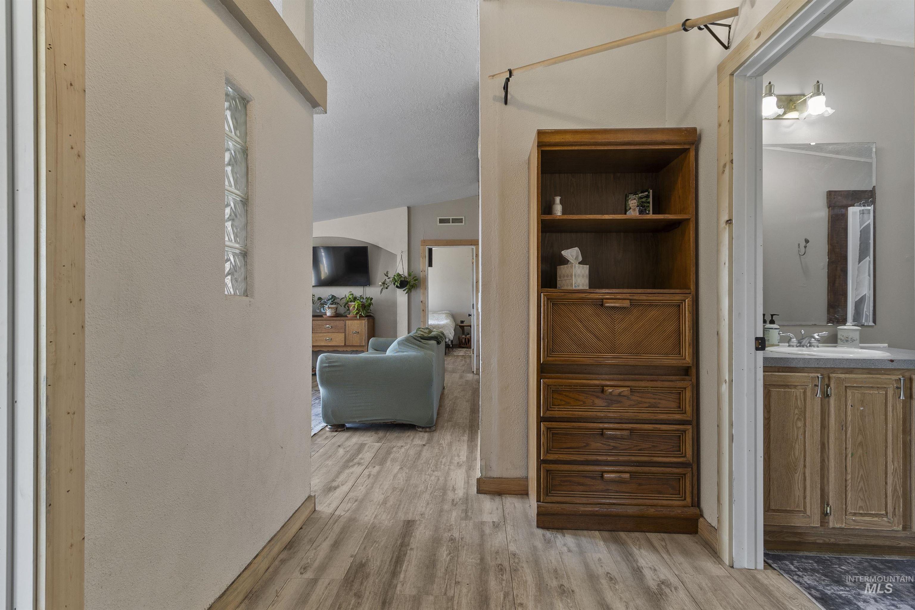 1311 Gold Hill Road Princeton, ID 83857 - Photo 9 of 25 Hall with light wood-style floors and lofted ceiling