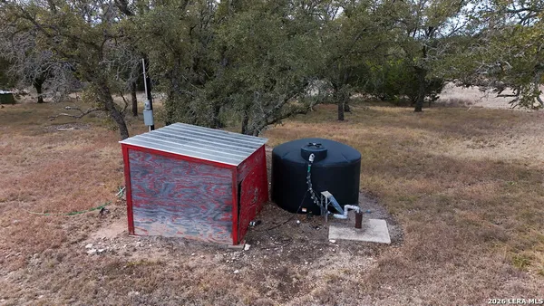 a view of a chairs in a backyard