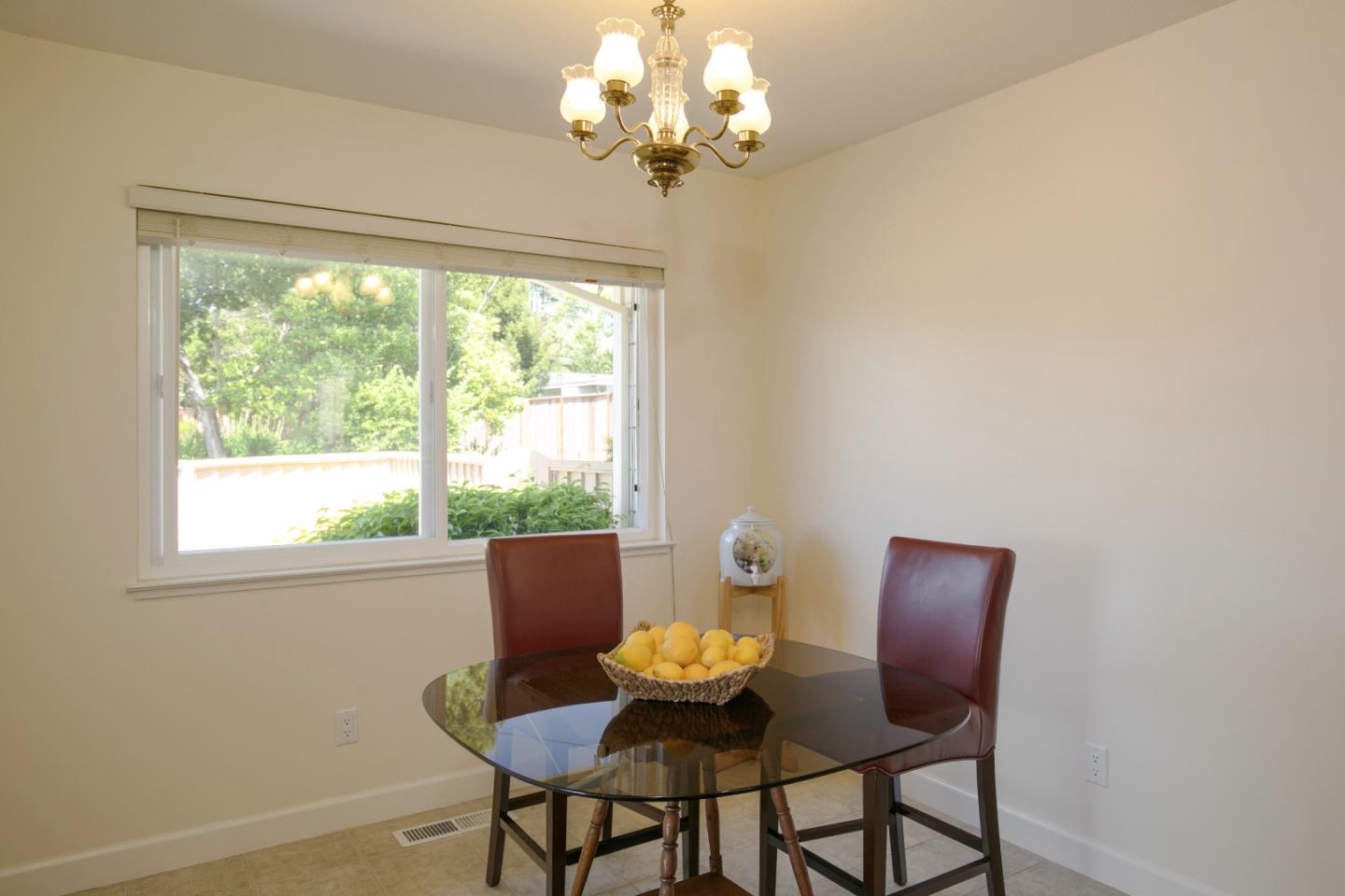 36 Robak Drive Watsonville, CA 95076 - Photo 12 of 39 a view of a dining room with furniture a chandelier and a window