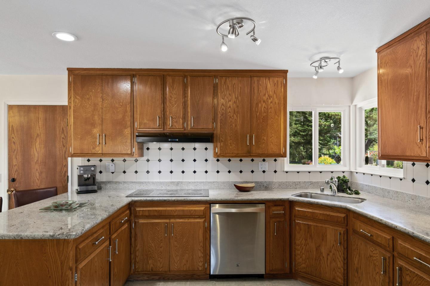 36 Robak Drive Watsonville, CA 95076 - Photo 15 of 39 a kitchen with stainless steel appliances granite countertop a sink stove and cabinets
