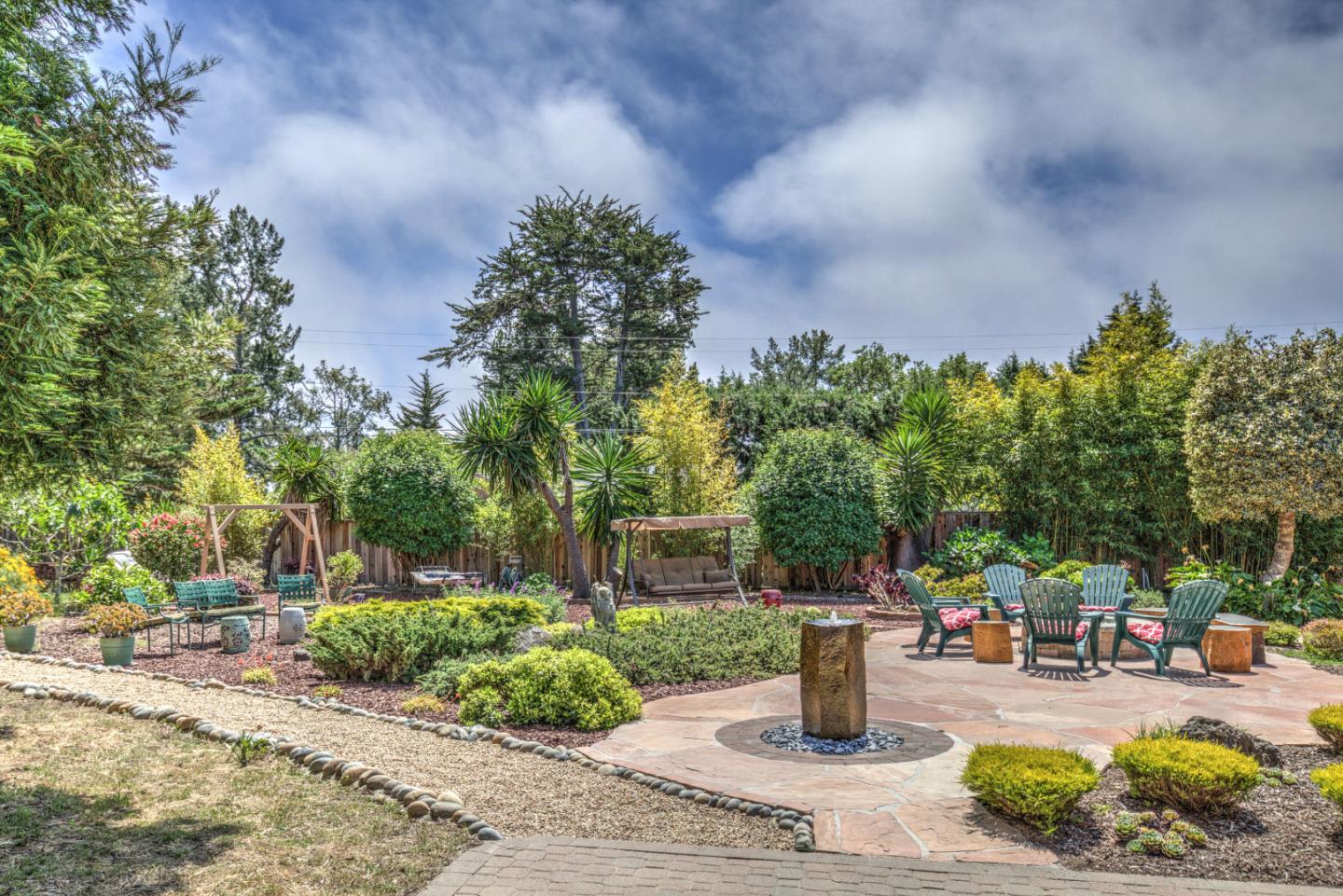 36 Robak Drive Watsonville, CA 95076 - Photo 2 of 39 a park view with potted plants and large trees