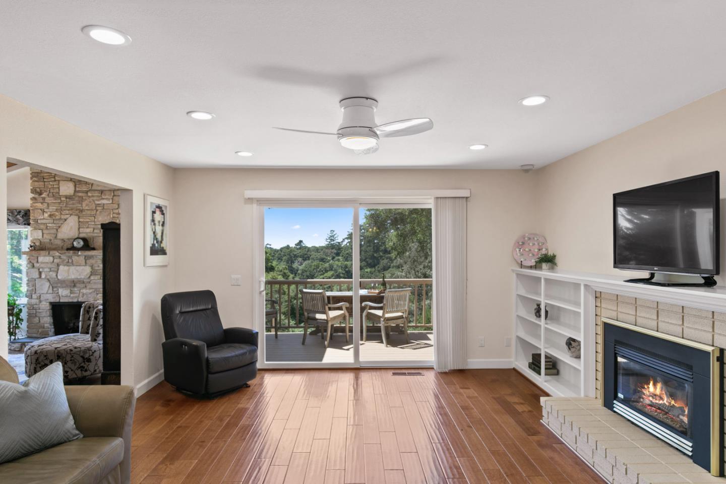 36 Robak Drive Watsonville, CA 95076 - Photo 10 of 39 a living room with furniture a fireplace and a flat screen tv