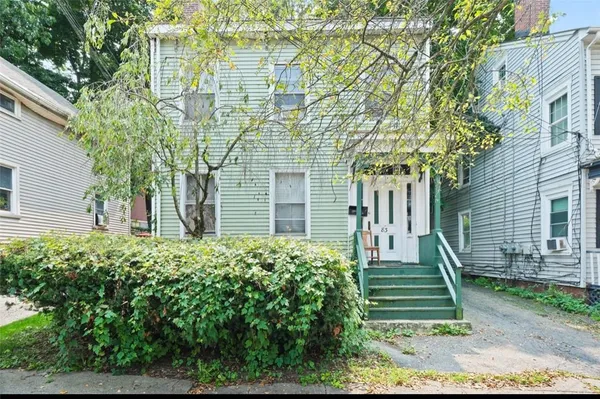 front view of a house with a yard