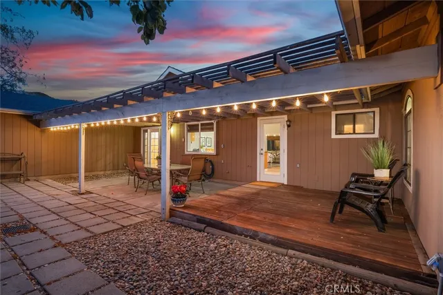a view of a livingroom with furniture and a workspace