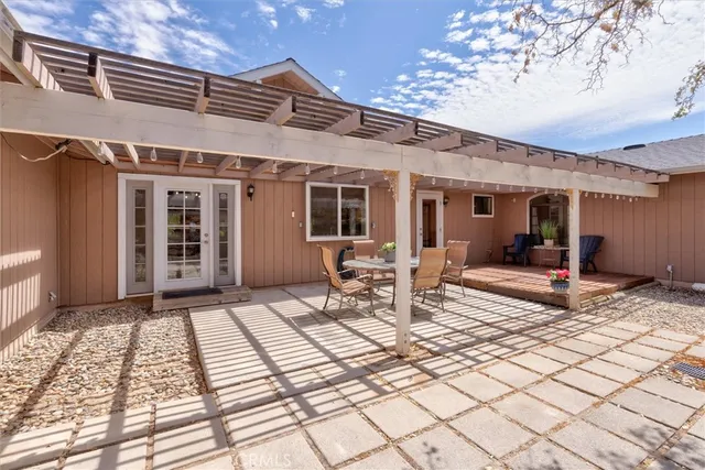 a view of a living room a flat screen tv and a window