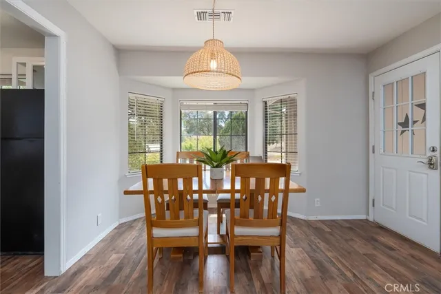 a view of a house with a yard and sitting area