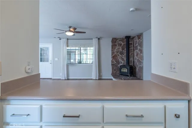 a front view of a house with a yard and potted plants