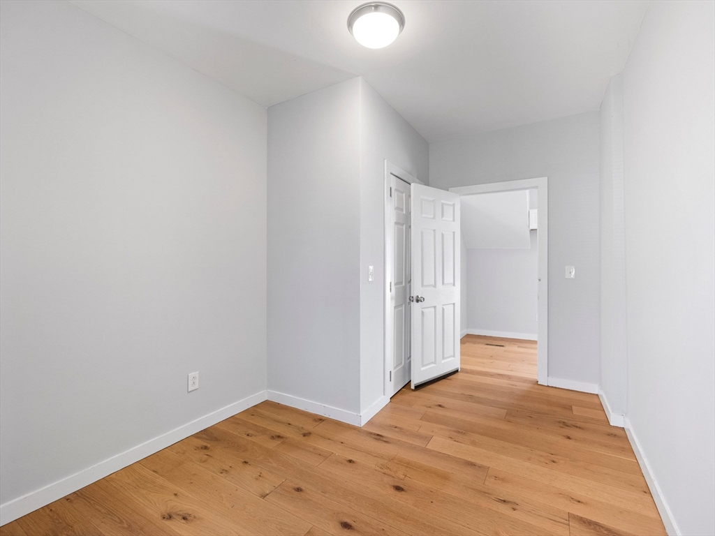 37 Howard Street Lynn, MA 01902 - Photo 14 of 42 a view of a room with wooden floor and white walls