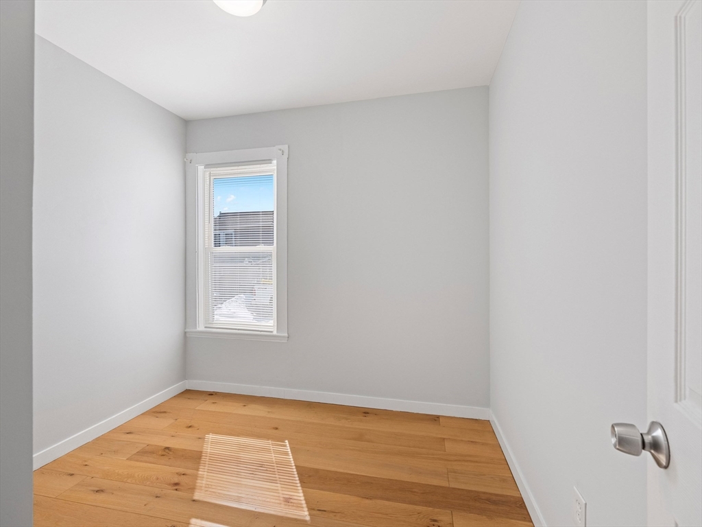 37 Howard Street Lynn, MA 01902 - Photo 15 of 42 a view of an empty room and window