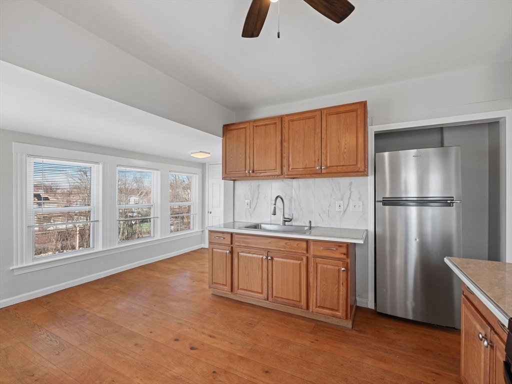 37 Howard Street Lynn, MA 01902 - Photo 26 of 42 a kitchen with appliances cabinets and a sink