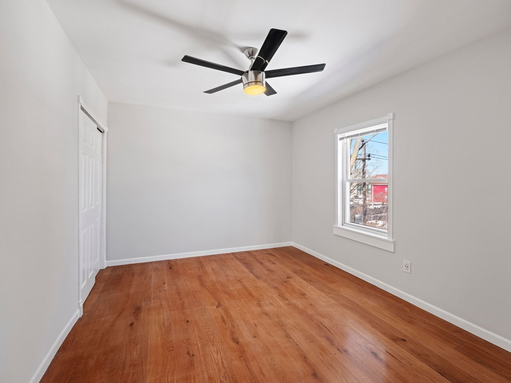 37 Howard Street Lynn, MA 01902 - Photo 29 of 42 a view of empty room with wooden floor