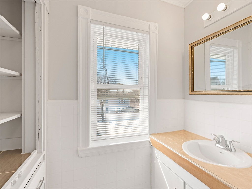 37 Howard Street Lynn, MA 01902 - Photo 31 of 42 a bathroom with a sink and a mirror