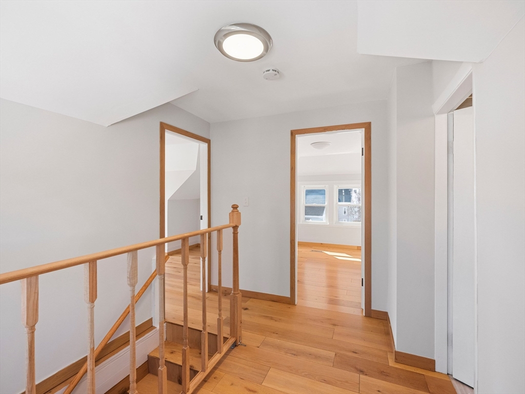 37 Howard Street Lynn, MA 01902 - Photo 35 of 42 a view of hallway with wooden floor and stairs