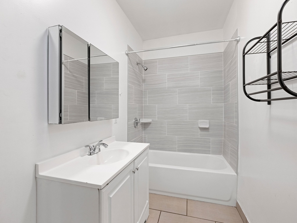 37 Howard Street Lynn, MA 01902 - Photo 9 of 42 a bathroom with a sink toilet and shower