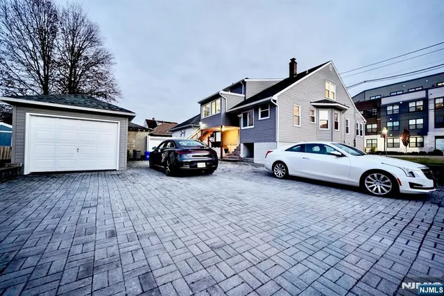 a view of a car parked in front of a house