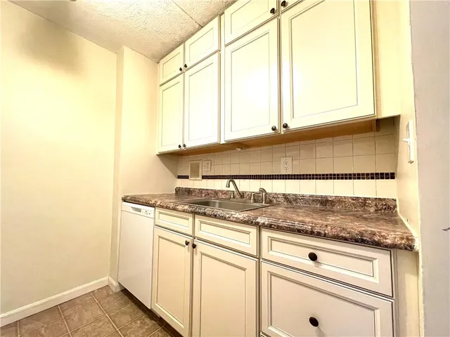 a bathroom with a sink and a window