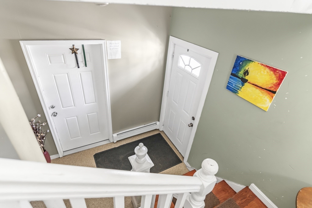191 Farnham Street Lawrence, MA 01843 - Photo 19 of 31 a view of a hallway with paintings on the wall