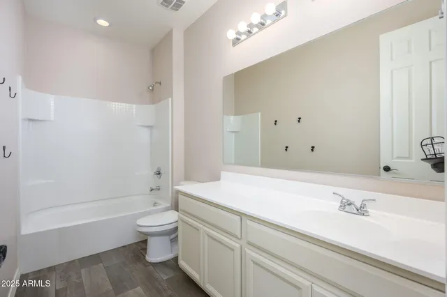 a bathroom with a sink a toilet and a bathtub