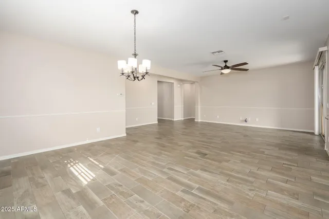 a view of a chandelier in big room and chandelier