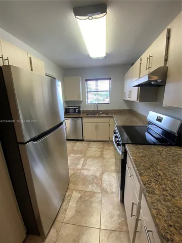 a view of a park with swings and slides