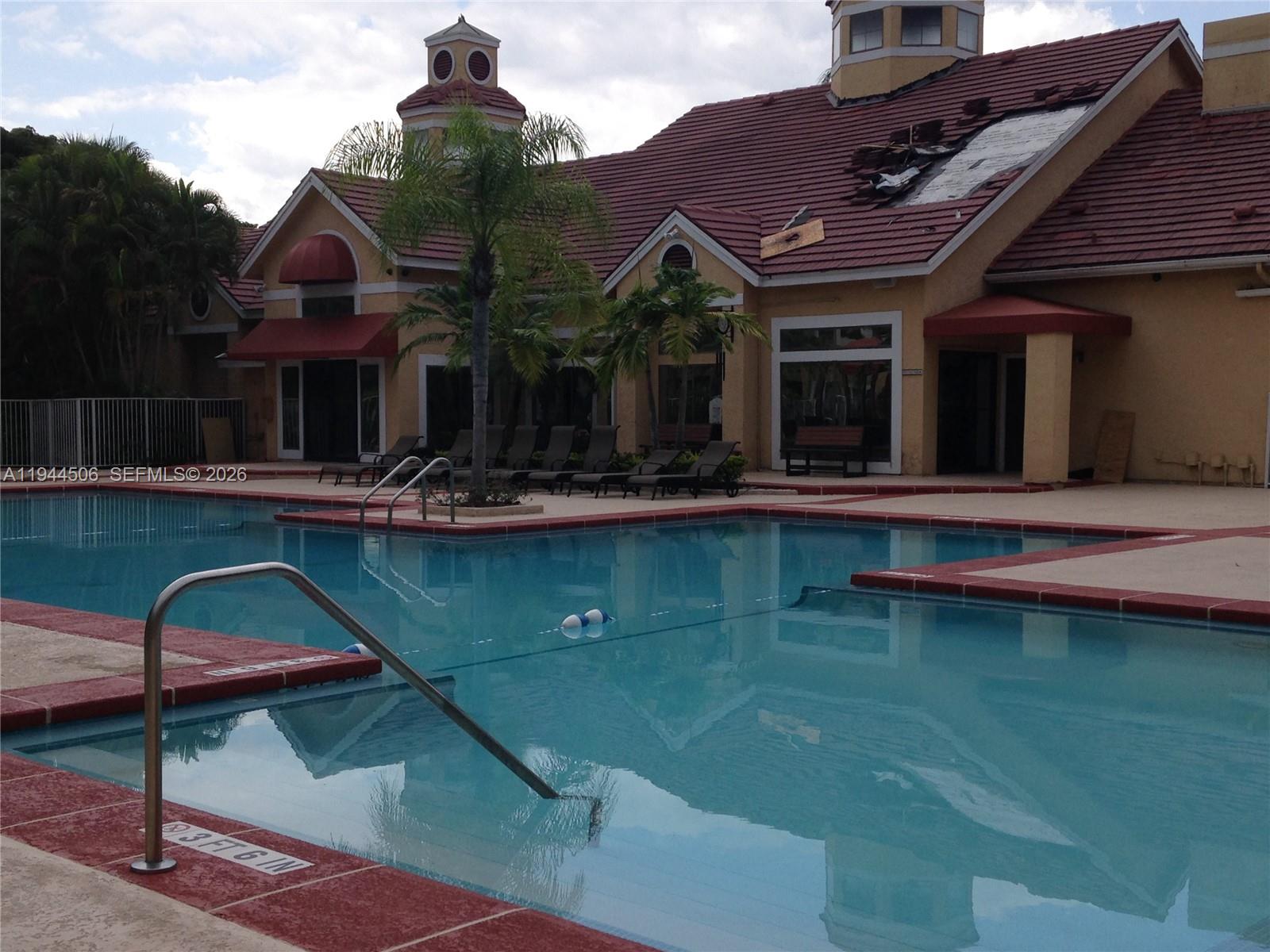 10441 Southwest 155th Court, Unit 921 Miami, FL 33196 - Photo 46 of 46 a front view of a house with swimming pool