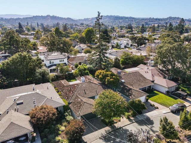 an aerial view of a house with a garden