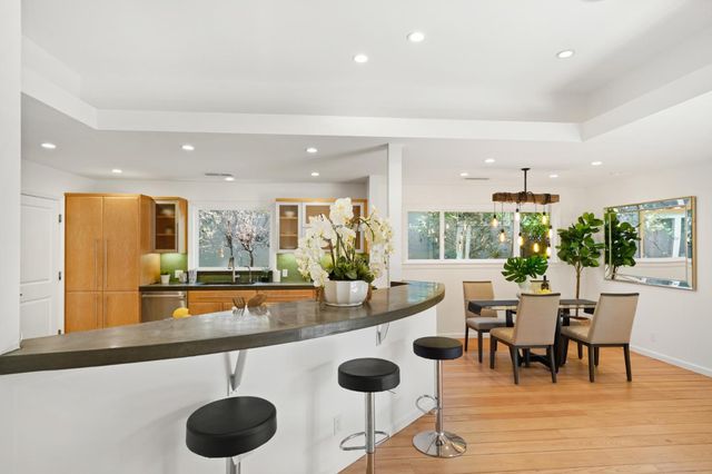 a room with lots of table and chairs