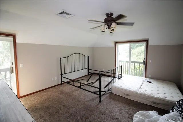 a bedroom with furniture and window