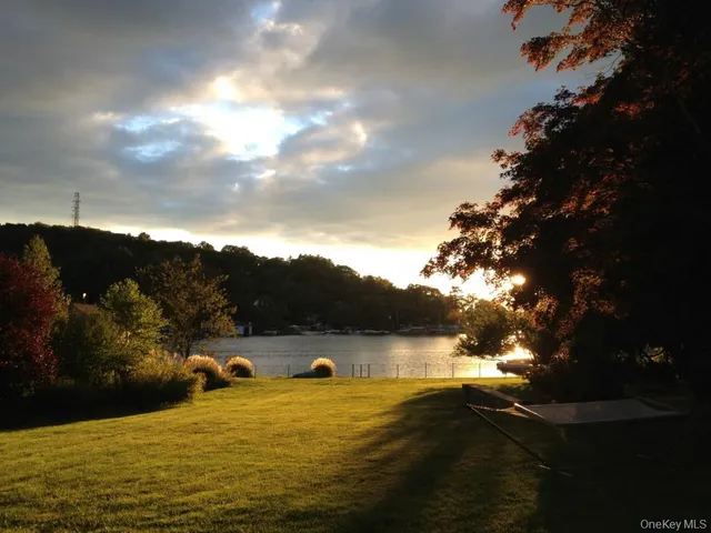 a view of ocean with green space