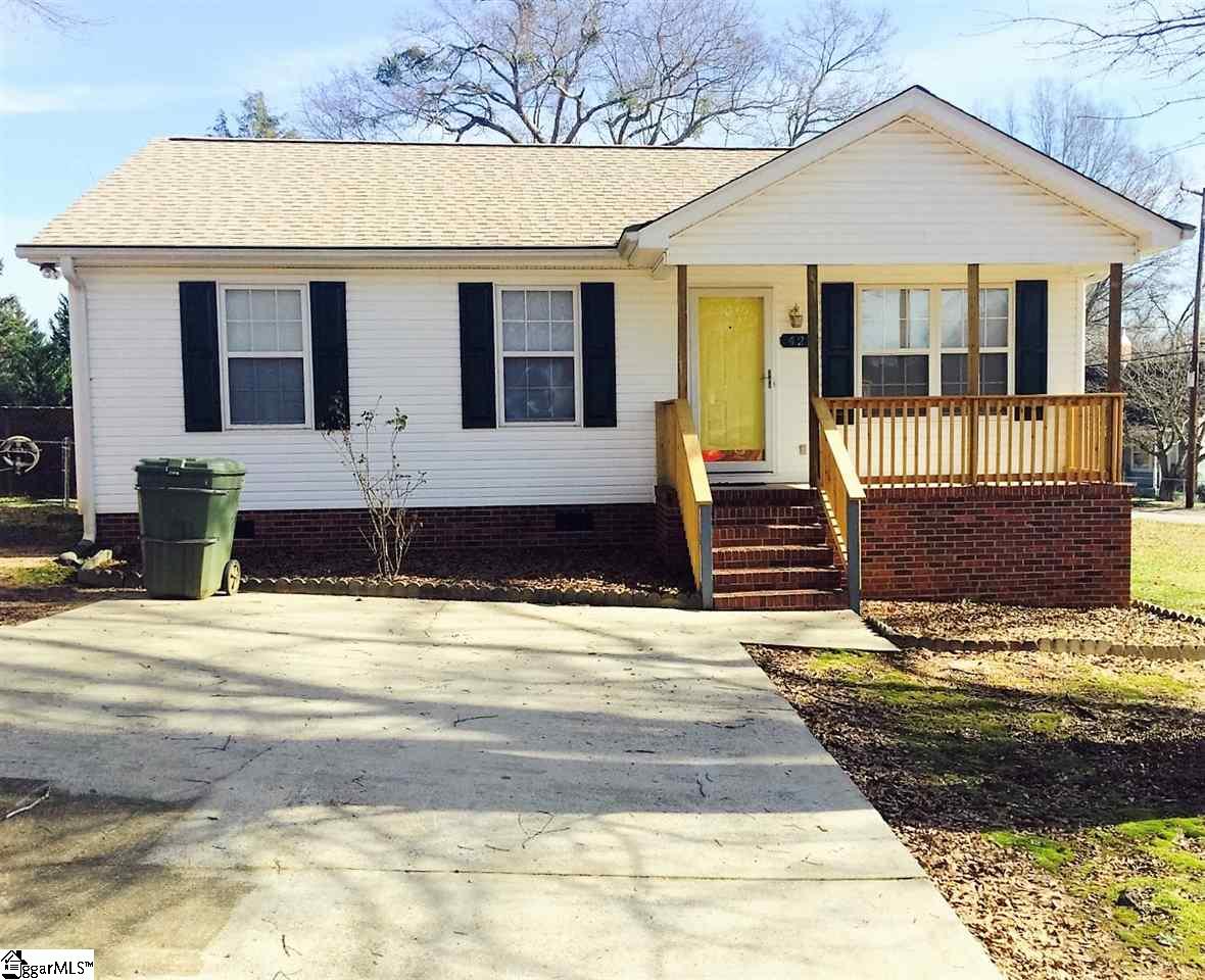 421 Craig Street Fountain Inn, SC 29644 - Photo 1 of 13 The front view with the paved driveway and inviting yellow front door.