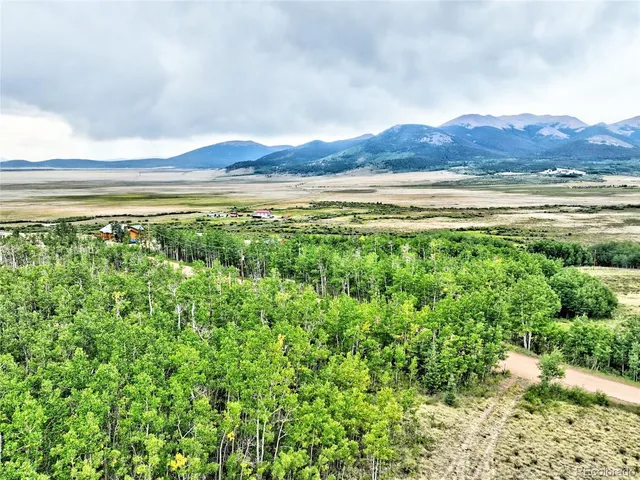a view of a and mountain in the distance in a field