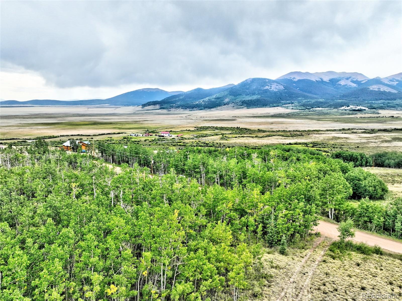 528 Glacier Peak View Road Jefferson, CO 80456 - Photo 16 of 44 a view of a and mountain in the distance in a field