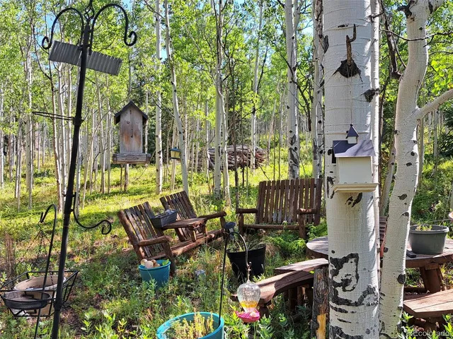 an outdoor sitting area with chairs
