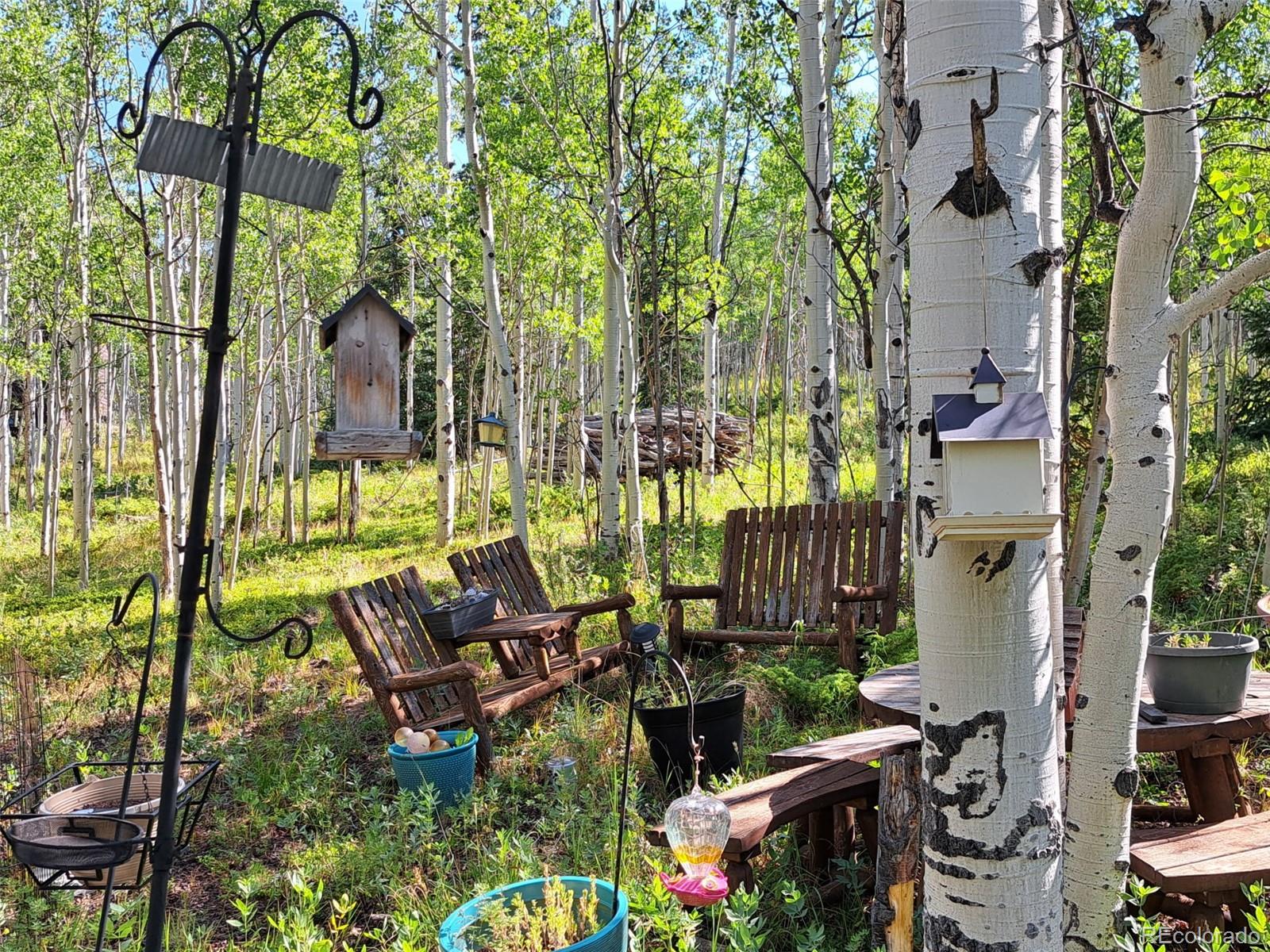 528 Glacier Peak View Road Jefferson, CO 80456 - Photo 30 of 44 an outdoor sitting area with chairs
