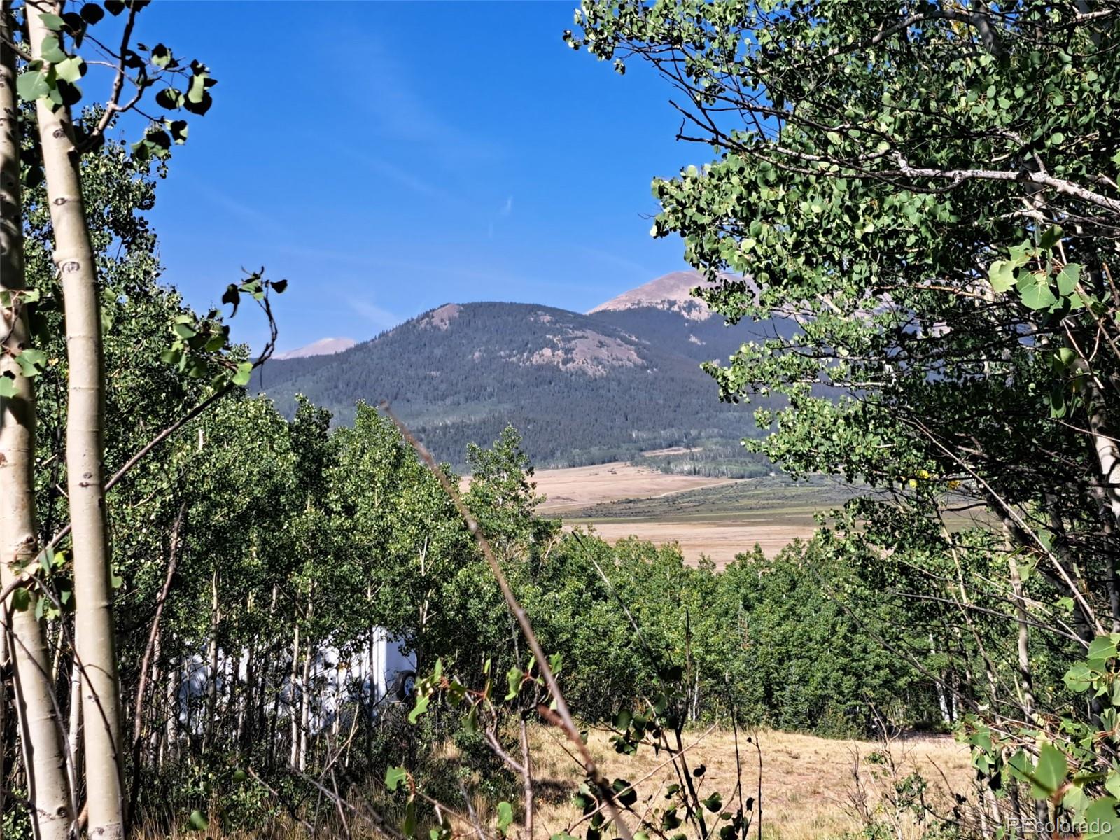 528 Glacier Peak View Road Jefferson, CO 80456 - Photo 41 of 44 a view of a house with a yard