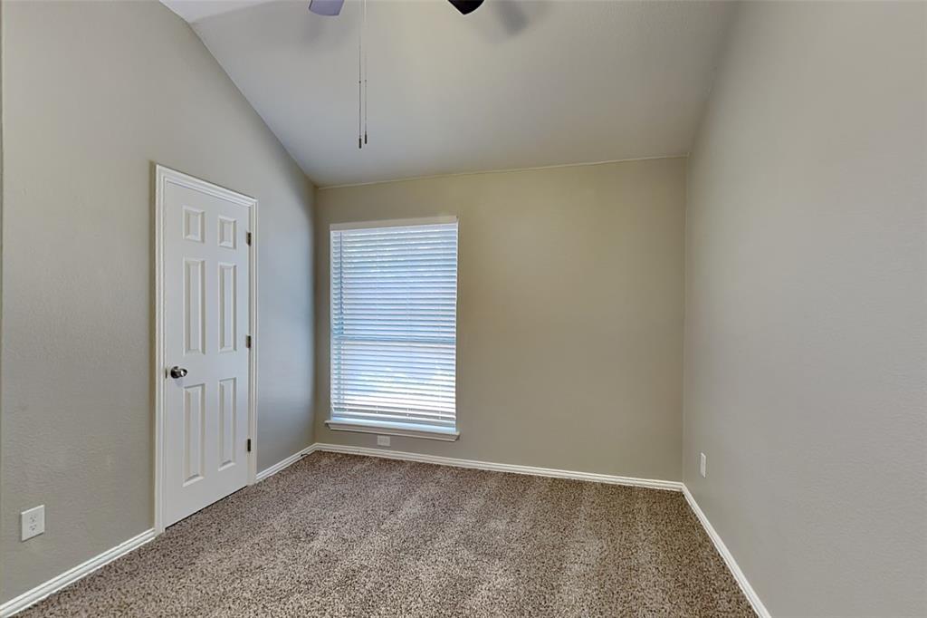 1703 Travis Court Allen, TX 75002 - Photo 14 of 21 Unfurnished room with carpet flooring, ceiling fan, and lofted ceiling