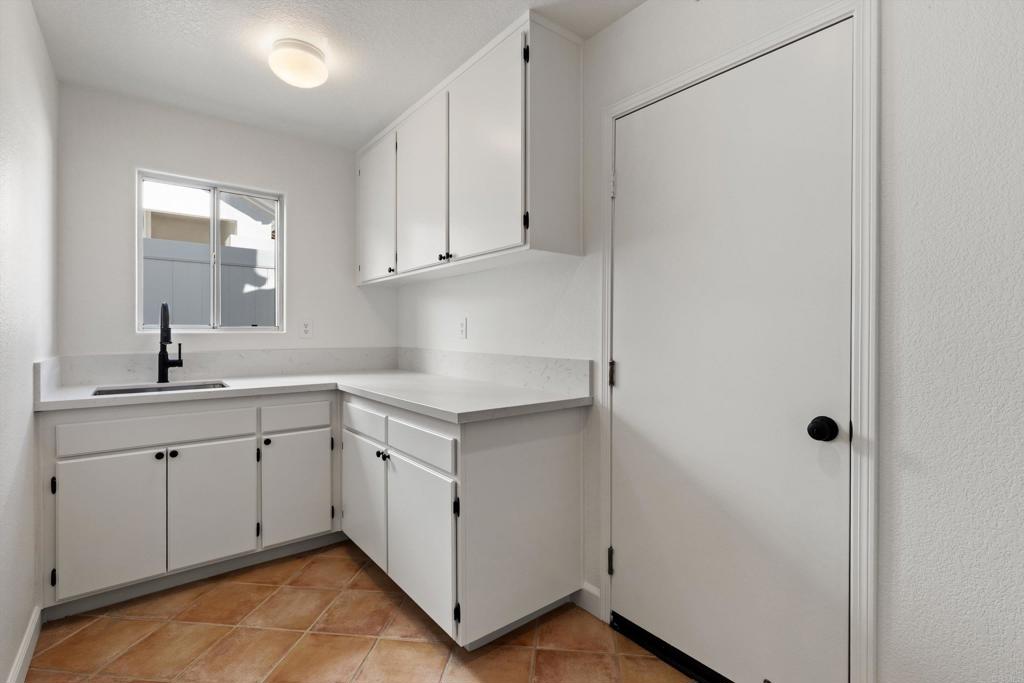 6012 Piros Way Oceanside, CA 92056 - Photo 20 of 47 New counters, sink, faucet and plenty of storage. Laundry is plumbed for a gas or electric dryer.
