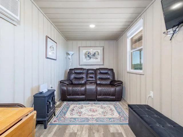 a kitchen with kitchen island granite countertop a sink cabinets and stainless steel appliances