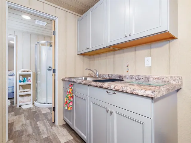 a room with furniture a rug and a window