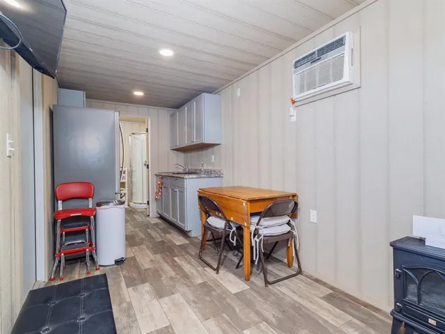 a room with furniture and a flat screen tv