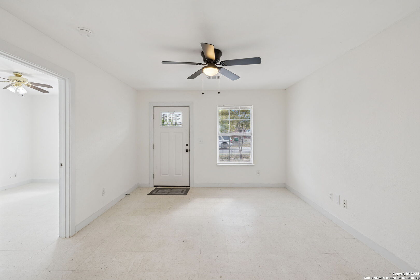 1349 Rivas Street San Antonio, TX 78207 - Photo 11 of 35 an empty room with windows and fan