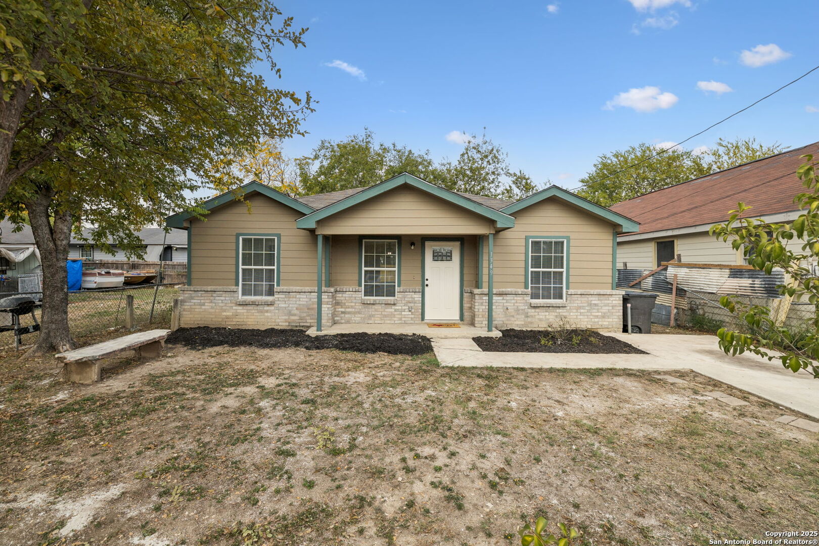 1349 Rivas Street San Antonio, TX 78207 - Photo 2 of 35 a front view of a house with a yard