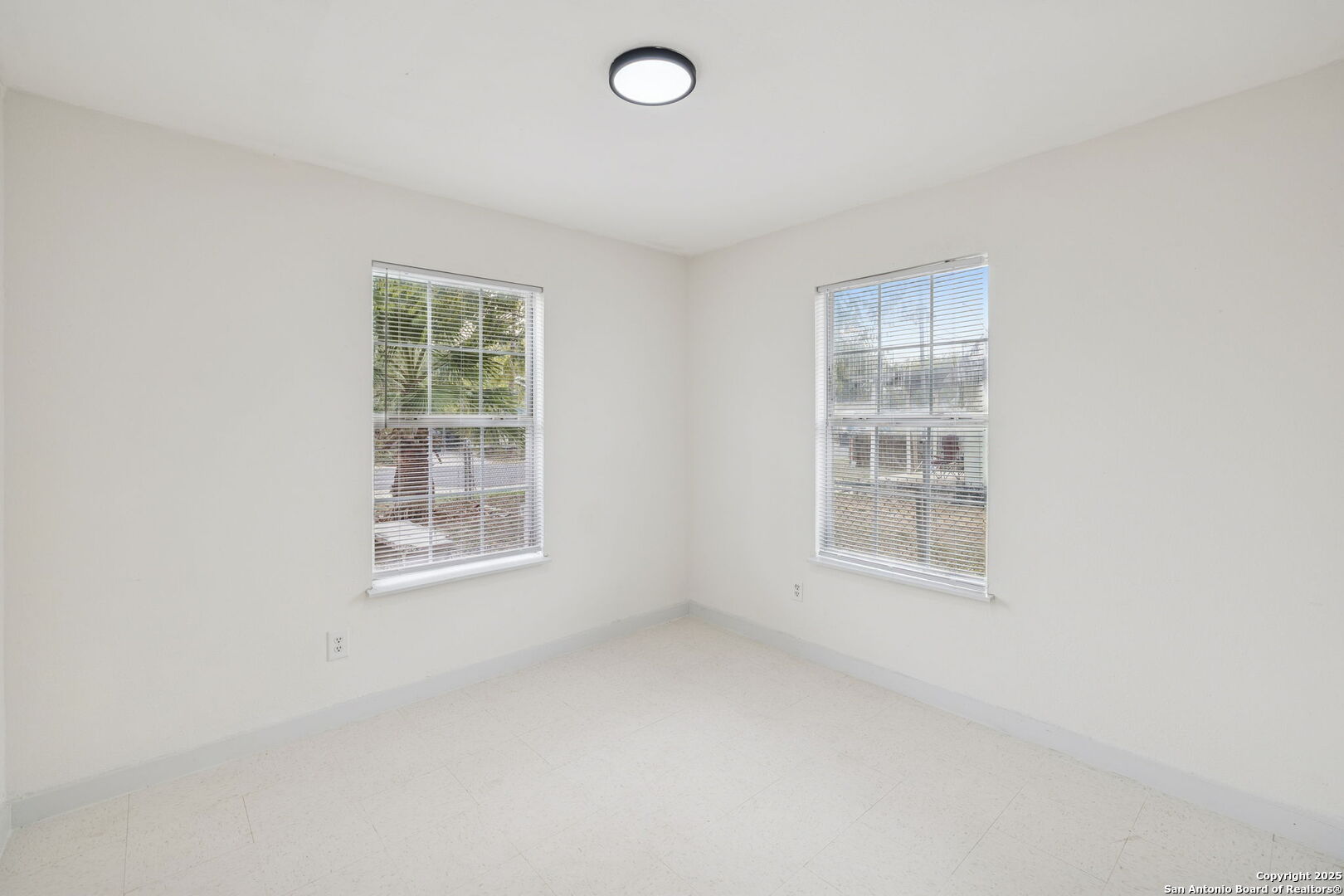 1349 Rivas Street San Antonio, TX 78207 - Photo 27 of 35 an empty room with windows