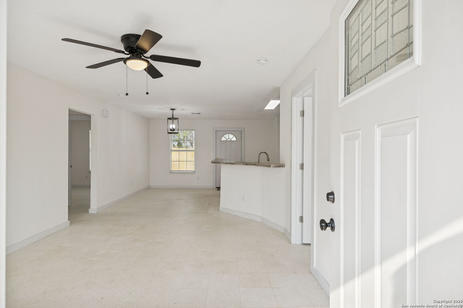 1349 Rivas Street San Antonio, TX 78207 - Photo 7 of 35 a view of a hallway with a ceiling fan